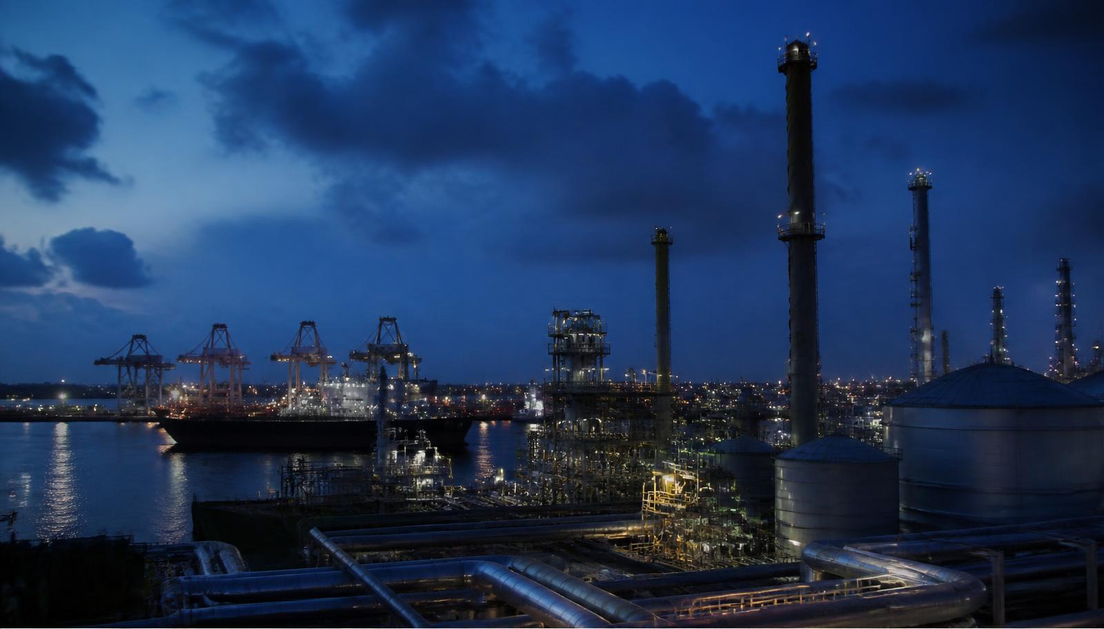 Industrial port and energy infrastructure at blue hour